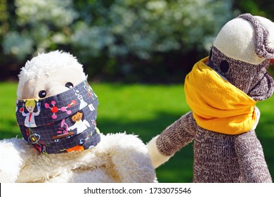 Two Childrens Plush Stuffed Animal Toys Earing A Face Mask During The COVID-19 Pandemic