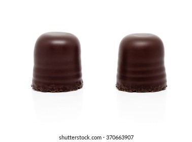 two chocolate covered marshmallows, isolated on white background with clipping path