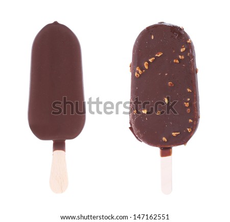 Two chocolate-coated blocks of ice cream on stick.