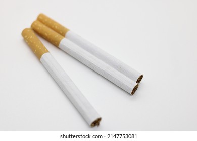 Two Cigars On White Background
