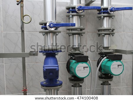 Two circulating pumps and the water filter - the boiler-house equipment
