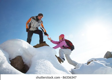 Two Climbers Ascend The Mountain