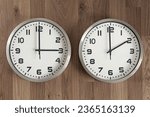 Two clocks, one showing three o