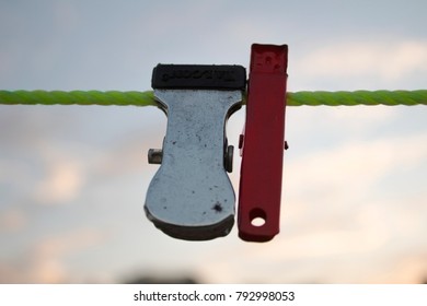Two Clothclips on Wire.