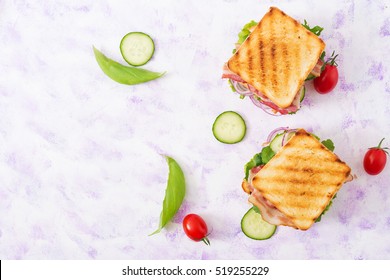 Two Club Sandwich With Chicken Breast, Bacon, Tomato, Cucumber And Herbs. Top View