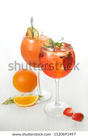 Two cocktails with decorations, fruits on white wood table texture. bar menu concept