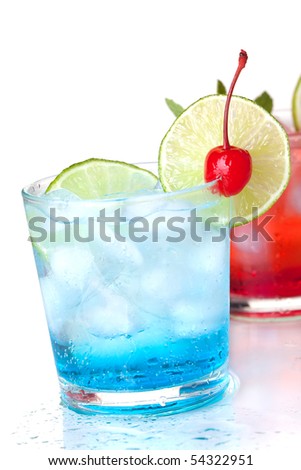 Two cocktails with lime slice and maraschino. Isolated on white background