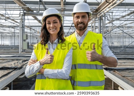 Two colleagues engineers looking confident while working together