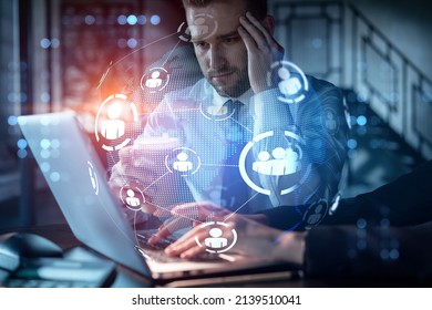Two colleagues in formal wear working together looking for new employees to hire for international business consulting. HR, social media icons over modern office background