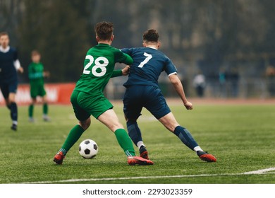 Two College Soccer Teams Playing Soccer League Game. Adult Soccer Players in a Duel. Two Football Players Competing in a Game. European Soccer Tournament Match For Adult Players.  - Powered by Shutterstock