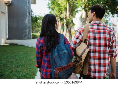 Two College Student Walking To Campus Shoot From Behind