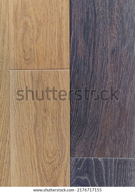 Two color light and dark laminate parquet flooring\
tiles dividing line