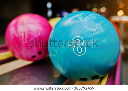 Two colored bowling balls of number 8 and 7. Kids ball for bowling