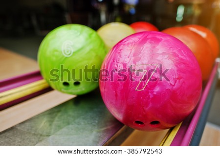 Two colored bowling balls of number 7 and 6. Kids ball for bowling