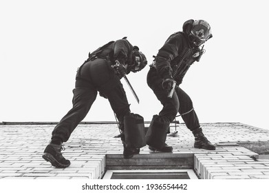 Two commandos train at the base. Climbers. SWAT, police, counterterrorism concept. Mixed media