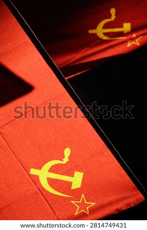 Two communist flags, high contrast