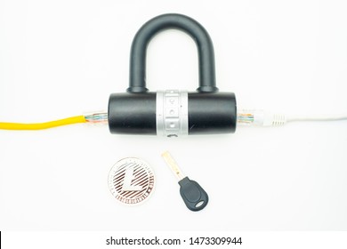 Two computer network cables going through a lock with a key and a crypto currency coin, depicting digital security, cybersecurity or internet security