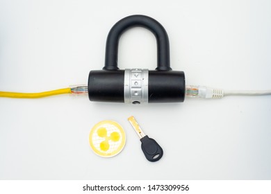 Two computer network cables going through a lock with a key and a crypto currency coin, depicting digital security, cybersecurity or internet security
