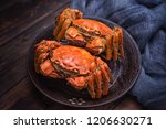 Two cooked hairy crabs on the table.