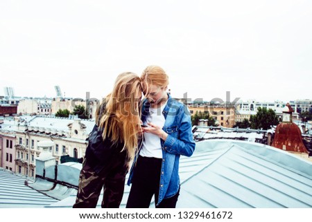 two cool blond real girls friends making selfie on roof top, lifestyle people concept, modern teens