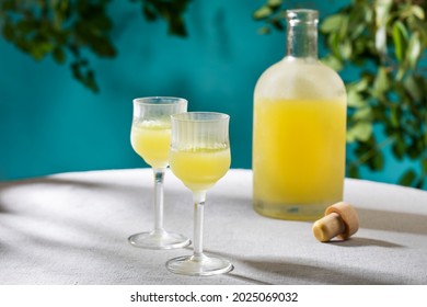 Two cordial glasses of limoncello, traditional Italian liqueur