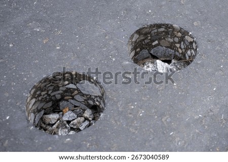Two core samples revealing the structure of asphalt pavement