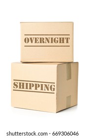 Two Corrugated Cardboard Carton Parcels With Overnight Shipping Imprint