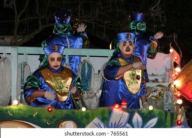 Two Costumed Men On A New Orleans Mardi Gras Float