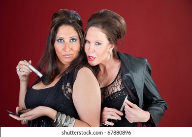 Two Cougars Dressed In Black Tease Each Other And Prepare Their Makeup