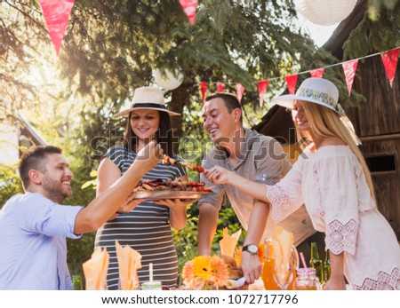 Similar – Freunde essen Kuchen und haben Spaß auf der Party.