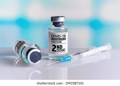 Two COVID-19 Vaccine Vials Tagged With 1st And 2nd Dose For Vaccination Of Patients. Vaccine Bottles Identified With First And Second Dose Labels For Covid-19 Immunization