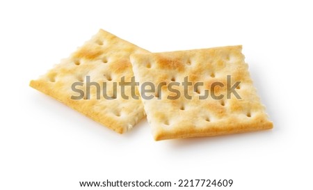 Two crackers placed on a white background. 