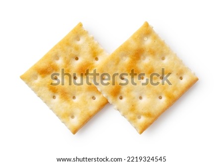 Two crackers placed on a white background. Viewed from above.
