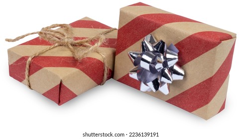 Two craft gift boxes wrapped in striped brown and white paper with boes isolated on white