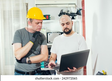The two craftsmen working together, selective focus - Shutterstock ID 242972065