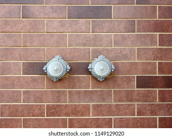 
Two cranes of the fire hydrant, mounted in a brick wall.					