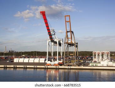 Two Cranes Of Jacksonville City Port In The Evening Light (Florida).