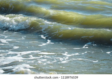 Two crashing waves with white foam