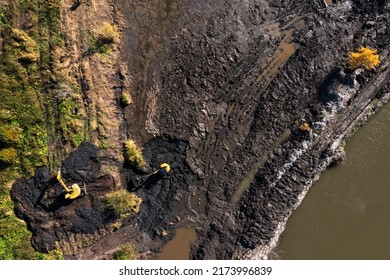 Two Crawler Excavators Cleans The Pond Of Silt And Algae. Earthworks Service, Cleaning Of Water Bodies.