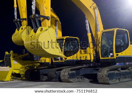 Two crawler excavators close up. Hyundai Robex 260LC-95 Crawler Excavator