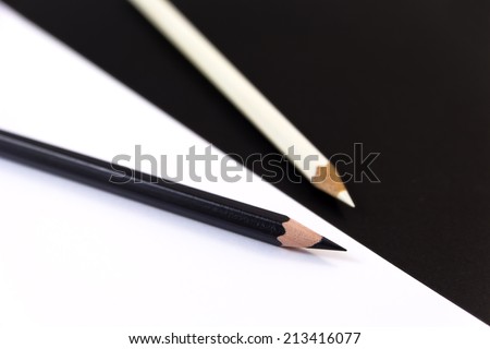 Two Crayons in black and white with black and white background.