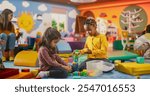 Two Creative Multiethnic Girlfriends Playing in Kindergarten. Little Indian and African Girls Constructing a House Out of Colorful Building Blocks. Children Having Fun in Modern Daycare Center