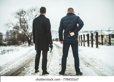 Two Criminal Men Standing With Guns