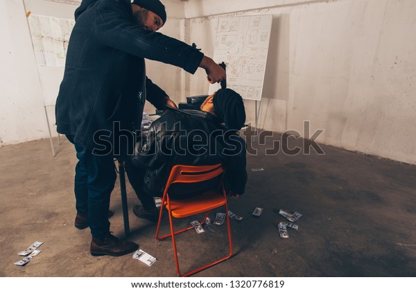 Two Criminals Sitting Room Full Money Royalty Free Stock Image