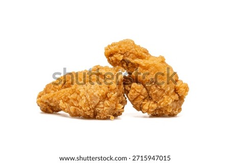 Two crispy fried chicken wings isolated on white background with copy space. Crunchy fast food meal ideal for menus, ads, and restaurant branding.