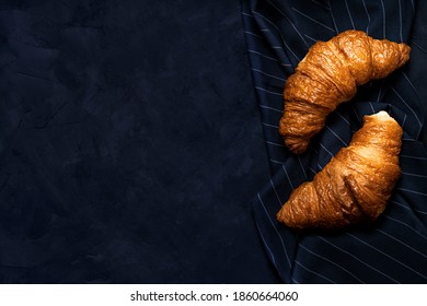 Two Croissants On Dark Blue Napkin On Dark Slate Background.top View