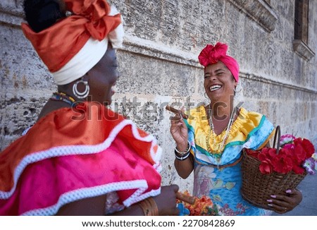 Two Cuban canasteras with habano flowers and typical costume