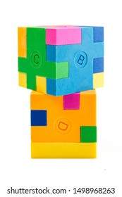 Two cube puzzle of multi-colored rubber shapes. Concept of decision making process, creative, logical thinking. Logical tasks. Conundrum, find the missing piece of the proposed.