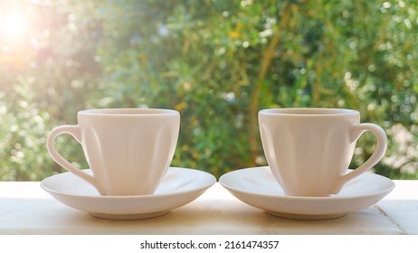 Two Cup Of Coffee Or Brewed Turkish Tea On Green Nature Background. Drinking Coffee To Start A Day Positive Mood Or Stay Awake, Sleepless. Coffee (espresso, Americano Etc.) Addiction Concept.