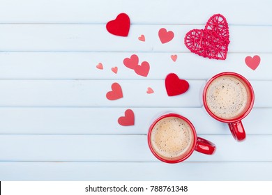 Two Cup Of Coffee And Mixed Hearts On Pastel Blue Table Top View. Morning Breakfast For Valentines Day. Love Concept.